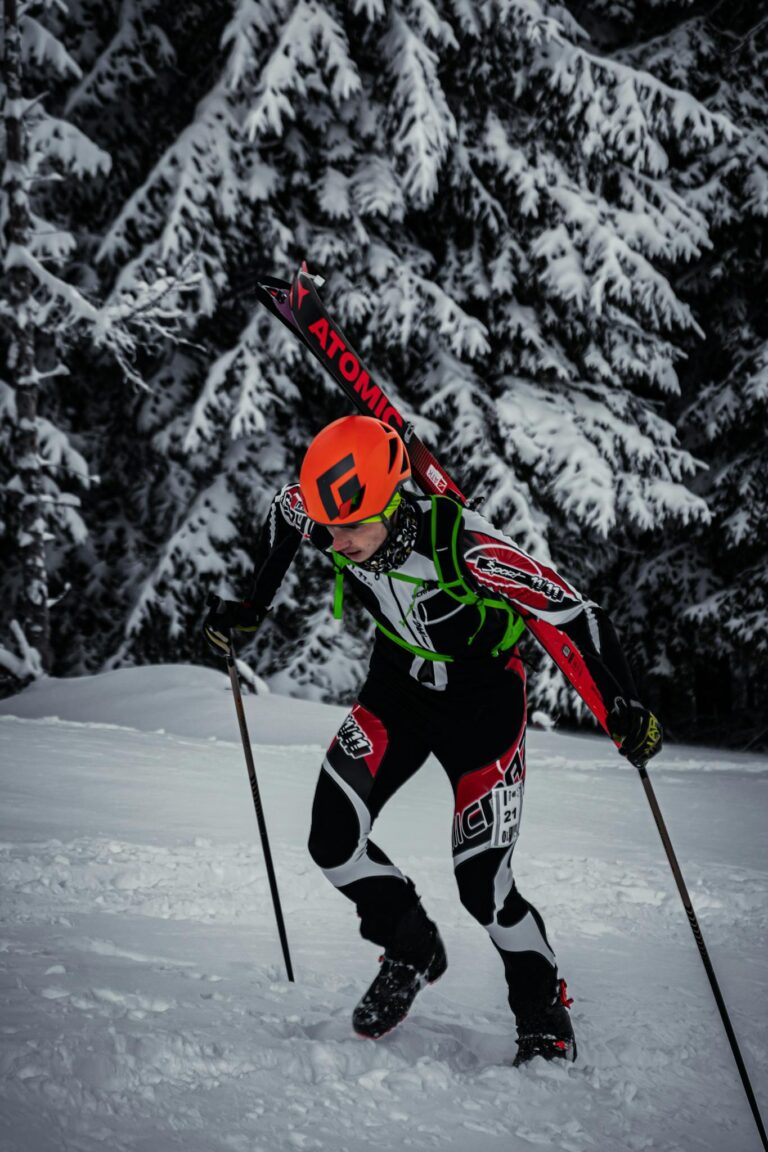 A skier climbs up a snowy slope in Mozirje, Slovenia, during winter activities.